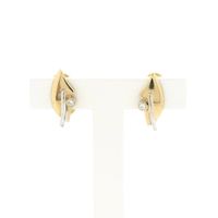 Two-tone gold clip-on earrings with diamonds; 0.04 ct.