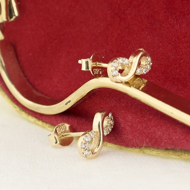 Image 7 of Gold infinity stud earrings with zirconia