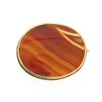 Antique gold brooch with carnelian bandagate