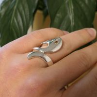 Artistic silver ring with zirconia