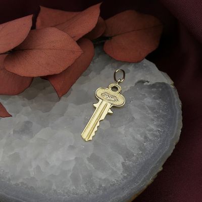 Image 2 of 18 carat gold pendant of a key