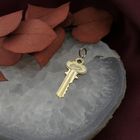 Image 2 of 18 carat gold pendant of a key
