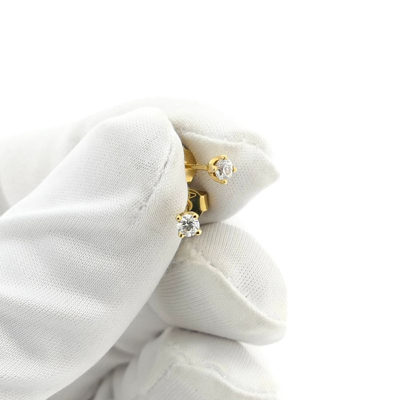 Image 10 of Gold solitaire stud earrings with diamonds; 0.12 ct.