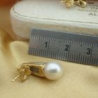 Image 7 of 18 carat gold stud earrings with cultured pearl and 0.18 ct diamond.