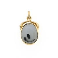 Gold pendant with hematite