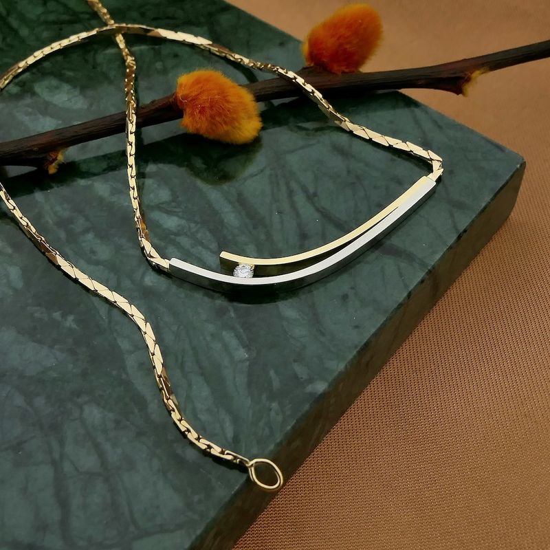 Image 2 of Two-tone gold cobra link necklace with a fixed pendant and diamond