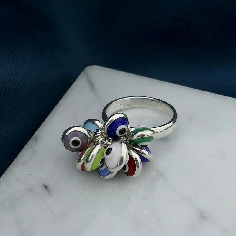 Image 2 of Silver ring with multiple colored Nazar eye charms