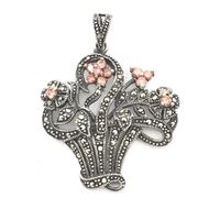 Silver pendant with orange zirconia and marcasite; floral bouquet
