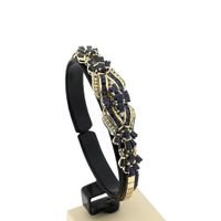 Golden Omega Link Bracelet with Sapphires and Diamonds; 0.30 ct.