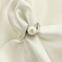 White gold ring with pearl and diamonds; 0.05 ct