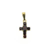 Gold cross pendant with garnet stones