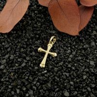 Gold pendant of a cross