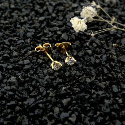 Gold solitaire stud earrings with diamonds; 0.12 ct. Image 2 of Gold solitaire stud earrings with diamonds; 0.12 ct.