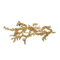Antique gold brooch with a coral branch, pearl and diamonds 0.35 ct.