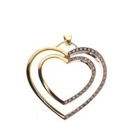 Two-tone gold pendant with a large heart and diamonds; 0.23 ct.
