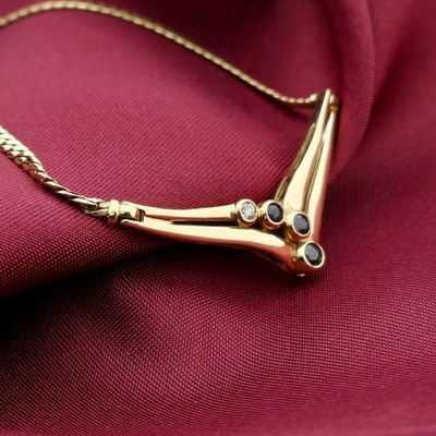 Image 2 of Gold necklace with fixed pendant, sapphire and diamond; 0.02 ct.