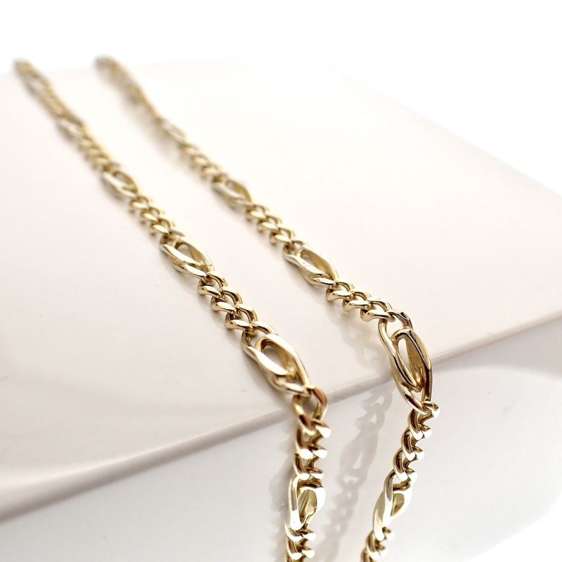 Image 2 of Two-tone gold Figaro link chain.