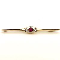 Antique gold brooch with diamond and ruby