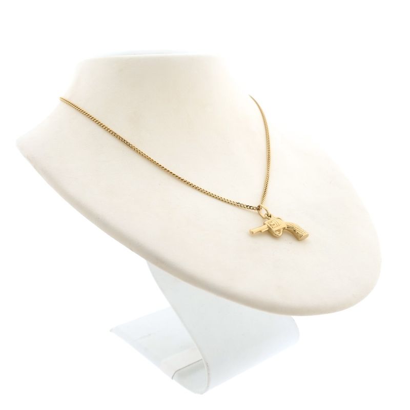 Image 7 of 18 carat gold pendant of a revolver.