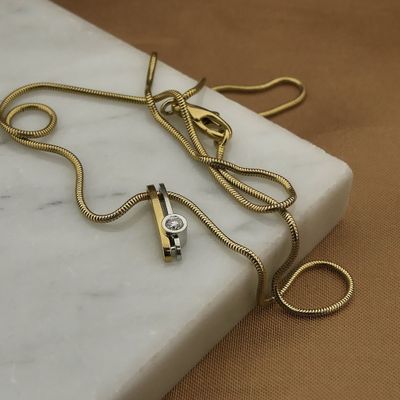 Image 2 of Two-tone gold necklace with fixed pendant and diamond; 0.10 ct.
