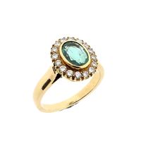 Gold ring with emerald and diamonds; 0.32 ct.