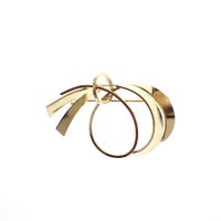 Golden fantasy brooch