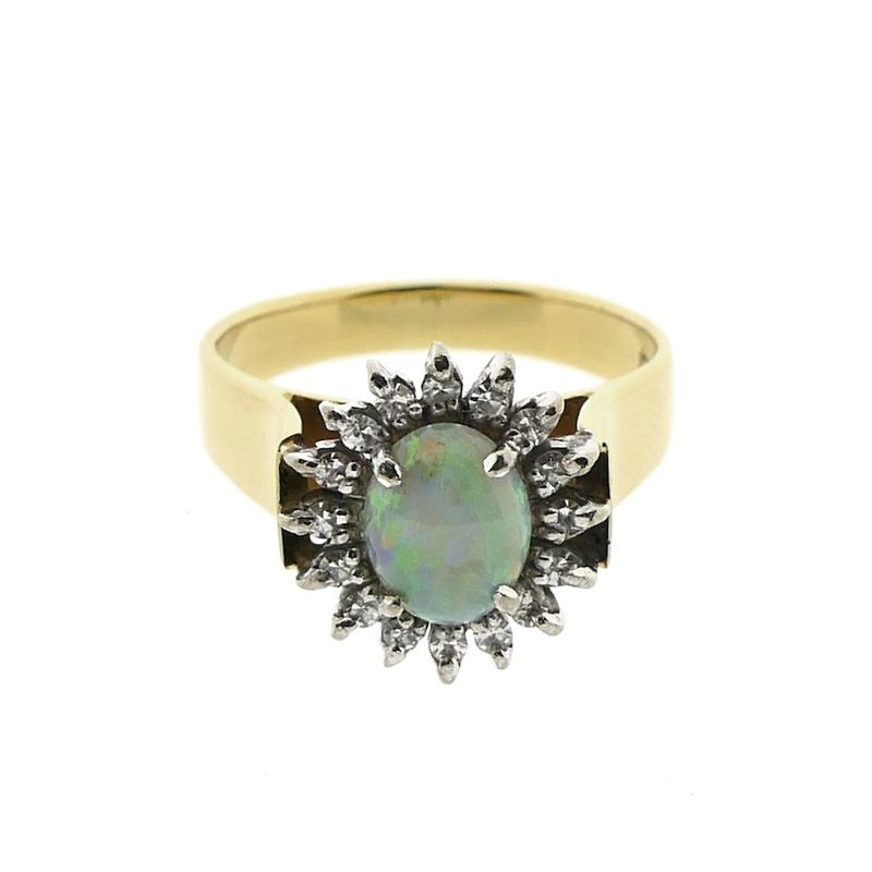 Image 2 of Gold ring with opal and entourage of diamonds; 0.16 ct.