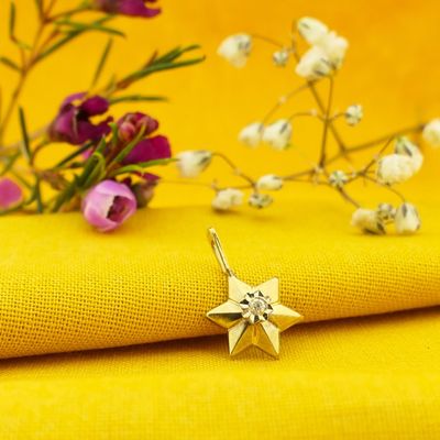 Image 2 of Gold subtle star pendant with diamond | 0.035 ct.