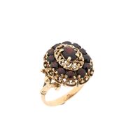 Gold entourage ring with garnet