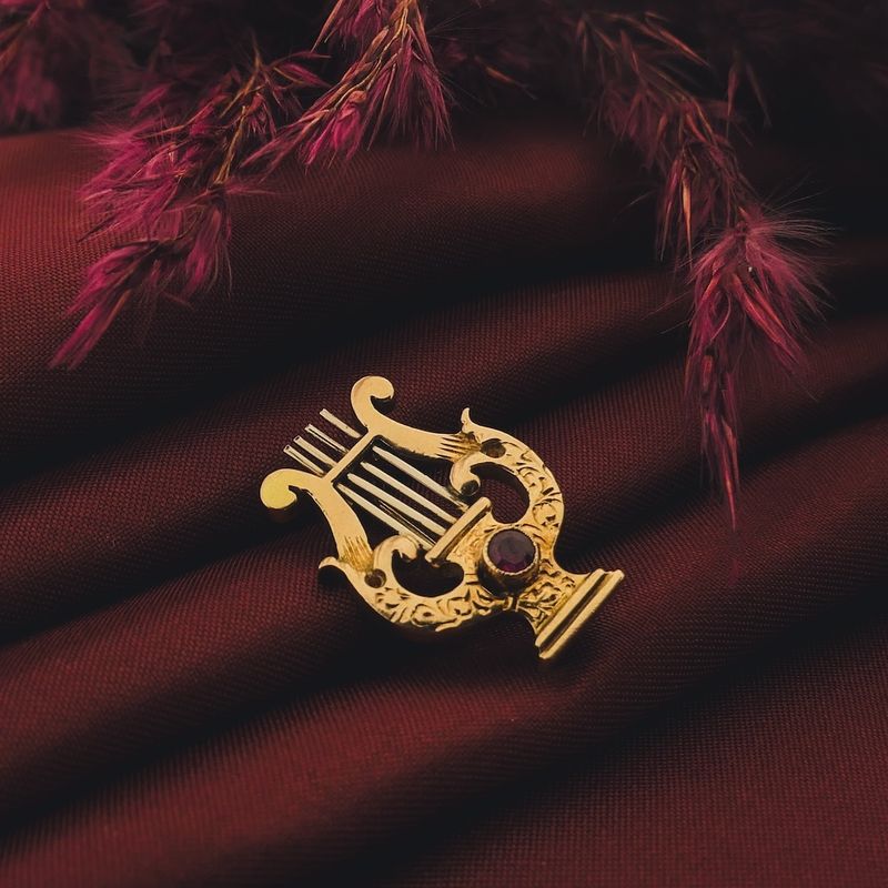 Image 2 of Gold brooch of a lyre harp with ruby