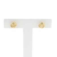 Gold twisted stud earrings as a button