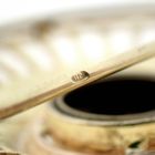 Image 9 of Two-tone gold brooch with garnet stone