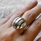 Image 5 of Silver ring with a wavy design.