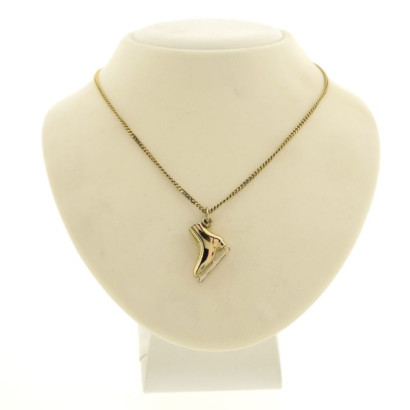 Image 3 of Two-tone gold pendant of a skate
