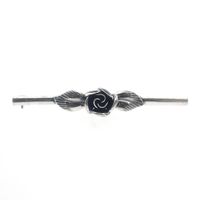Silver brooch of a rose