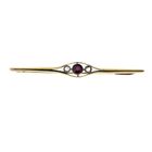 Image 1 of Gold brooch with ruby and diamonds; 0.12 ct.