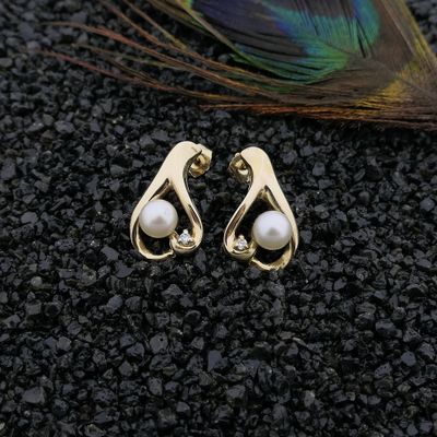 Image 2 of Gold stud earrings with pearl and diamond; 0.02 ct.