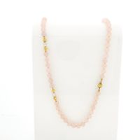 Rose quartz bead necklace with gold decorative clasp