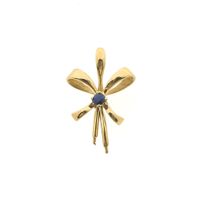 Gold pendant with a bow and sapphire