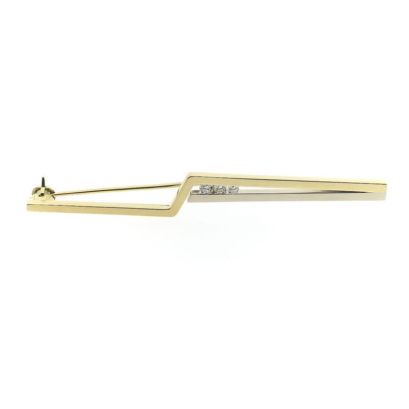 Image 1 of Two-tone gold long narrow brooch with diamonds; 0.15 ct.