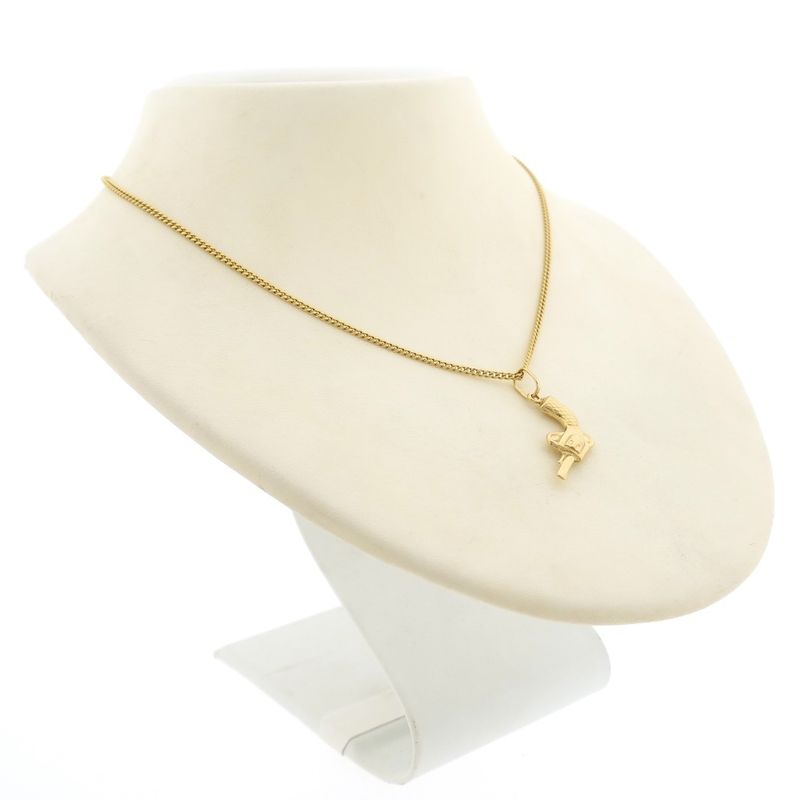 Image 6 of Gold pendant of a revolver.