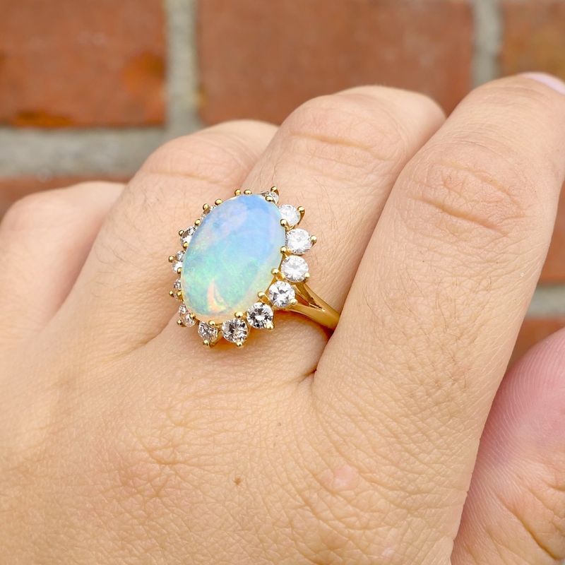 Image 4 of Gold ring with opal and diamond; 1.26 ct.