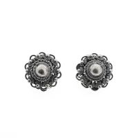 Silver clip-on earrings with a Zeeland button | Antique