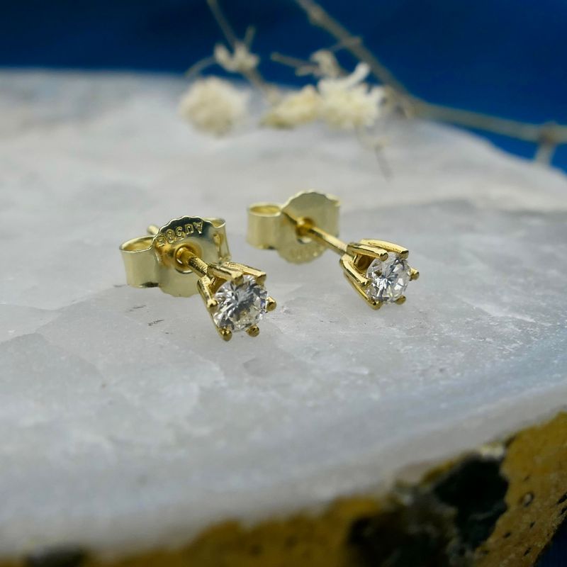 Image 2 of Gold solitaire stud earrings with diamond; 0.32 ct.