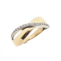 Two-tone gold ring with 0.105 ct diamonds.