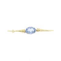 Gold brooch with blue topaz