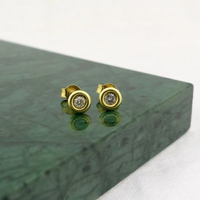 Gold subtle stud earrings with diamond | 0.20 ct. Image 2 of Gold subtle stud earrings with diamond | 0.20 ct.