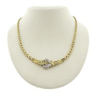 Two-tone gold necklace with 0.26 ct diamond pendant.