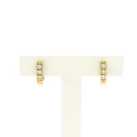 Gold stud earrings with diamonds