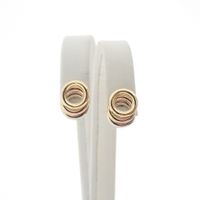18 ct. Tricolor gold stud earrings
